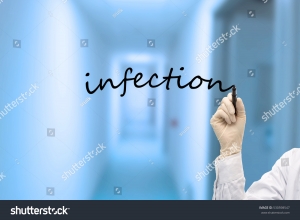 stock-photo-hand-of-doctor-with-marker-writing-infection-530598547.jpg
